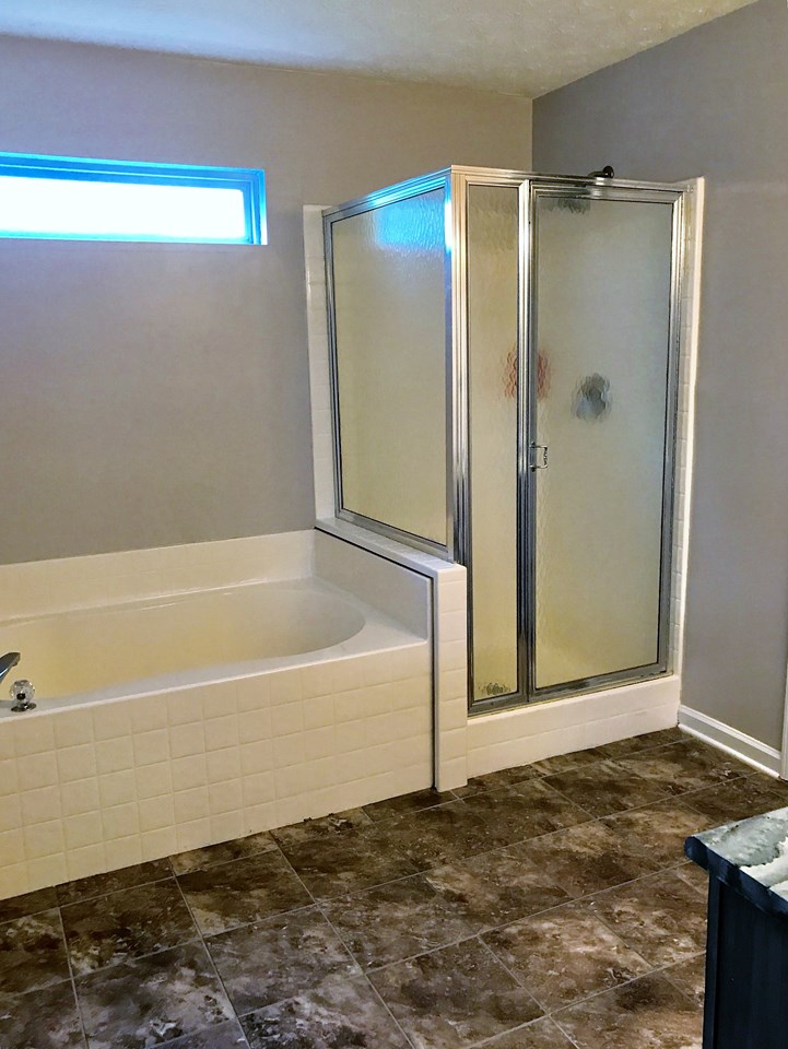 master bath with both soaking tub and separate shower