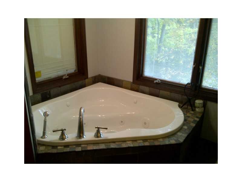 jetted corner tub in your master bath with guess what? yes! views of paradise lake! open up the windows and listen to the birds, squirrels and the breeze blowing through the leaves as you relax in this new tub. almost like being outside!