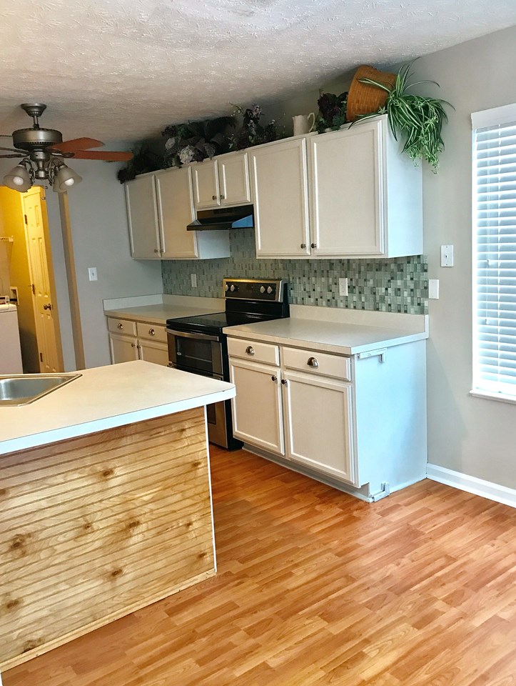 kitchen with new backsplash and stainless appliances