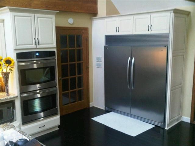 brazilian cherry hardwood floors, top end appliances. duel convection ovens. yes, that is a fridge/freezer!!!!